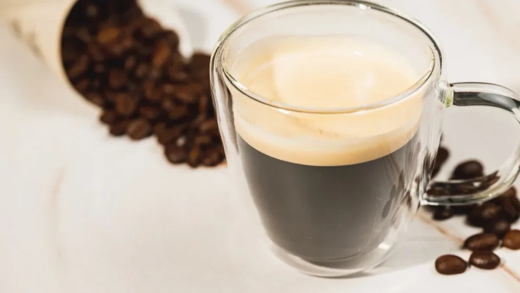 A double espresso shot pulling from a bottomless portafilter