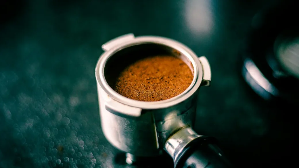 A finely ground coffee bed packed into a portafilter basket