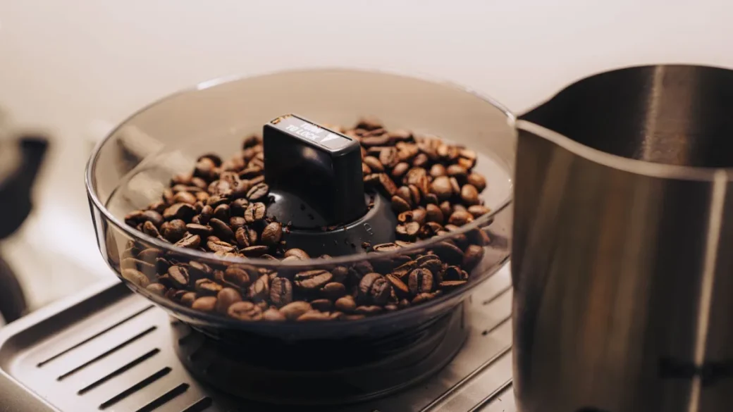 Adjusting an espresso grinder a few steps coarser to slow over-extraction