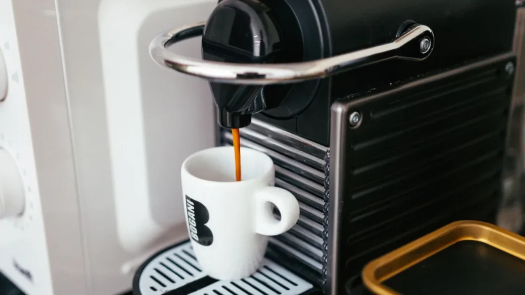 Inside a single-boiler espresso machine showing the brass boiler