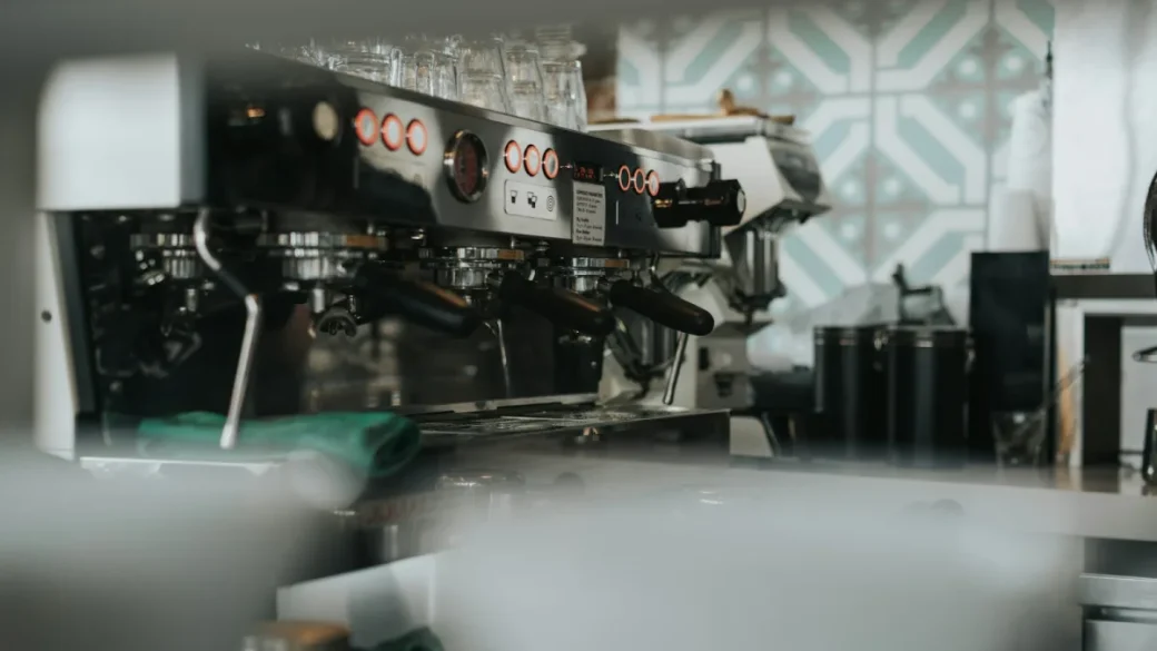 Interior of a home espresso machine showing switch wiring and terminals
