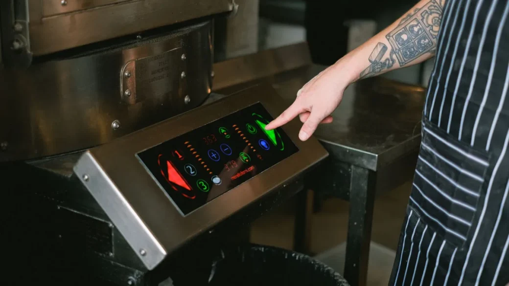 Pressing the reset button on a GFCI kitchen outlet