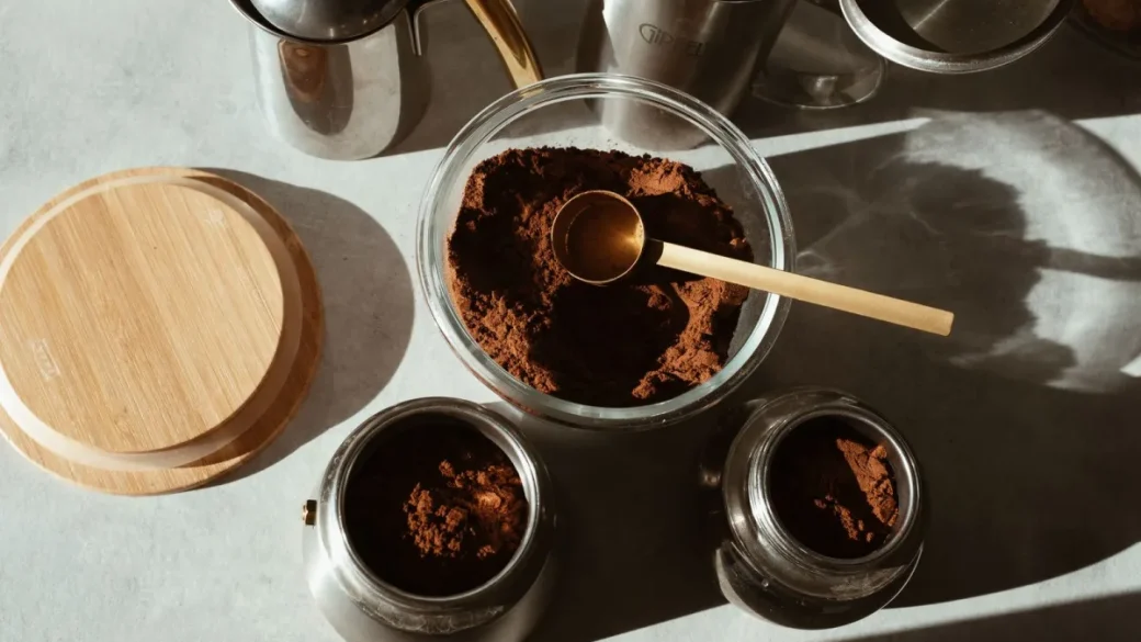 Conical burrs coated in stale coffee oil and packed fines