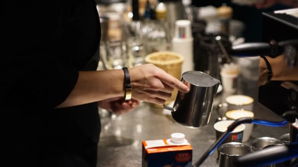 A level tamp on an evenly distributed coffee bed