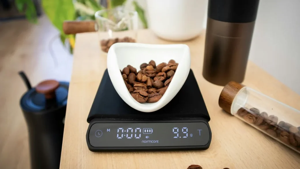 Weighing the shot yield on a scale under the portafilter